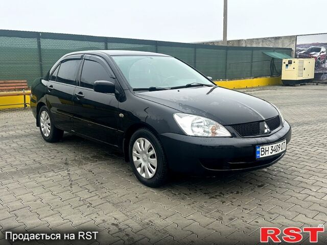 Чорний Міцубісі Lancer, об'ємом двигуна 1.6 л та пробігом 248 тис. км за 3950 $, фото 1 на Automoto.ua