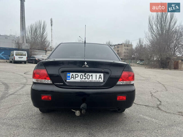 Чорний Міцубісі Lancer, об'ємом двигуна 1.58 л та пробігом 173 тис. км за 5099 $, фото 4 на Automoto.ua