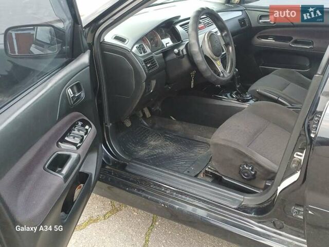 Черный Мицубиси Лансер, объемом двигателя 2 л и пробегом 286 тыс. км за 4000 $, фото 10 на Automoto.ua