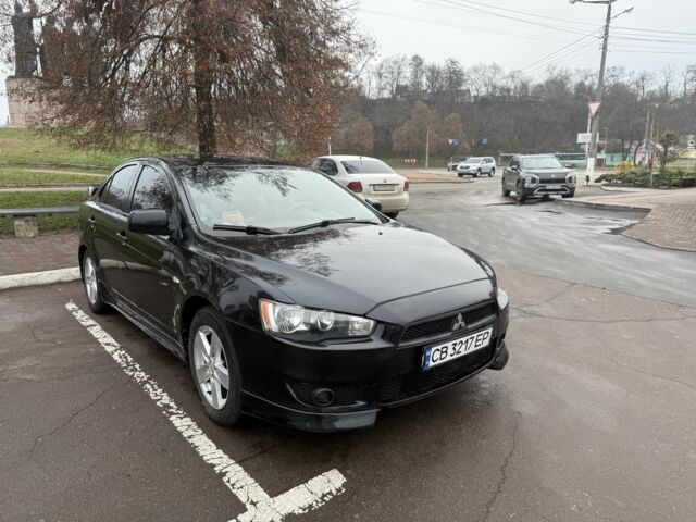 Черный Мицубиси Лансер, объемом двигателя 2 л и пробегом 281 тыс. км за 6000 $, фото 3 на Automoto.ua