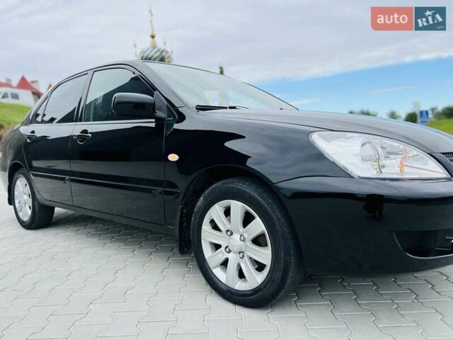 Чорний Міцубісі Lancer, об'ємом двигуна 1.6 л та пробігом 243 тис. км за 4950 $, фото 15 на Automoto.ua