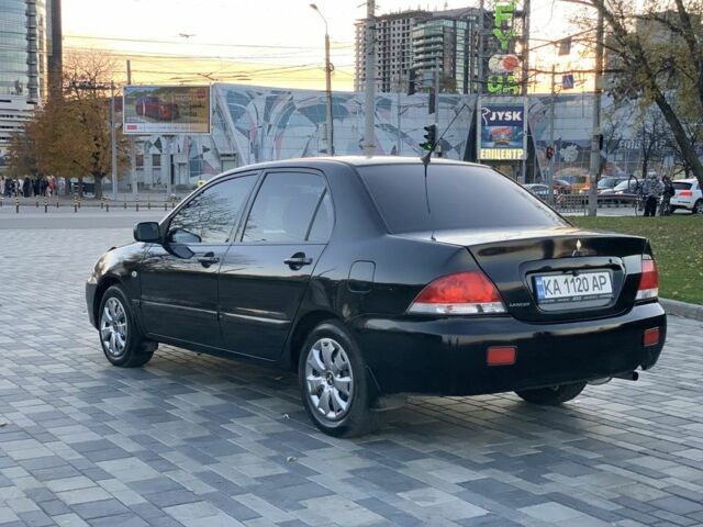 Черный Мицубиси Лансер, объемом двигателя 1.6 л и пробегом 237 тыс. км за 4300 $, фото 5 на Automoto.ua