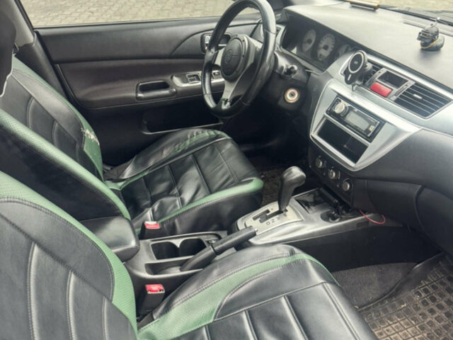 Чорний Міцубісі Lancer, об'ємом двигуна 2 л та пробігом 210 тис. км за 6000 $, фото 12 на Automoto.ua