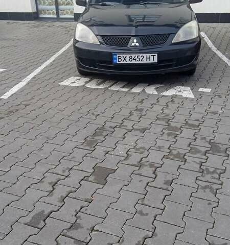 Черный Мицубиси Лансер, объемом двигателя 1.6 л и пробегом 223 тыс. км за 4300 $, фото 7 на Automoto.ua