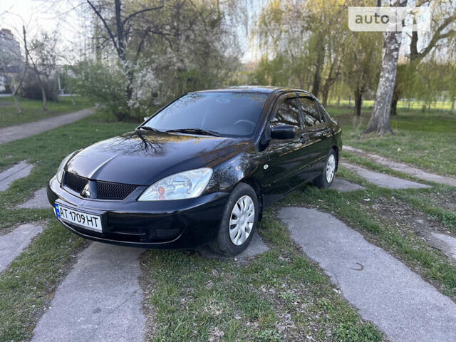 Чорний Міцубісі Lancer, об'ємом двигуна 1.58 л та пробігом 161 тис. км за 5300 $, фото 1 на Automoto.ua