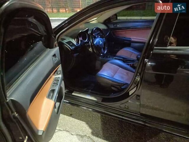 Черный Мицубиси Лансер, объемом двигателя 2 л и пробегом 240 тыс. км за 6400 $, фото 8 на Automoto.ua