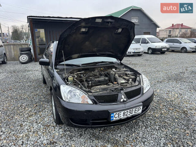 Черный Мицубиси Лансер, объемом двигателя 1.58 л и пробегом 202 тыс. км за 4100 $, фото 32 на Automoto.ua