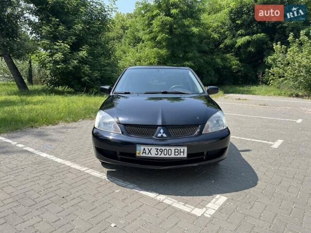 Чорний Міцубісі Lancer, об'ємом двигуна 1.6 л та пробігом 296 тис. км за 4200 $, фото 1 на Automoto.ua