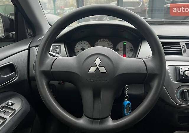 Чорний Міцубісі Lancer, об'ємом двигуна 1.6 л та пробігом 340 тис. км за 6190 $, фото 14 на Automoto.ua