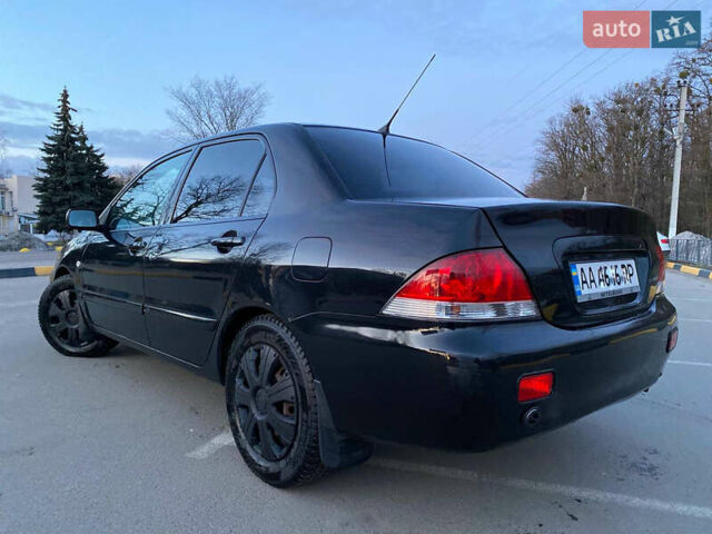 Чорний Міцубісі Lancer, об'ємом двигуна 1.58 л та пробігом 327 тис. км за 4000 $, фото 3 на Automoto.ua