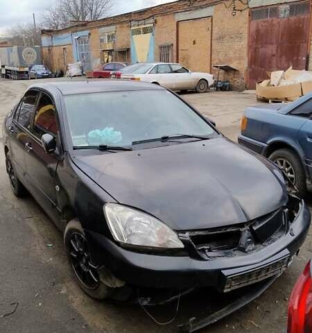 Черный Мицубиси Лансер, объемом двигателя 1.6 л и пробегом 200 тыс. км за 2000 $, фото 1 на Automoto.ua