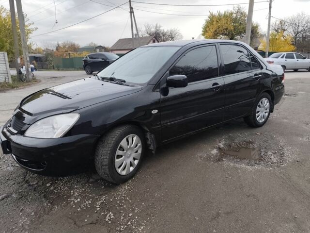 Черный Мицубиси Лансер, объемом двигателя 1.6 л и пробегом 270 тыс. км за 3800 $, фото 4 на Automoto.ua