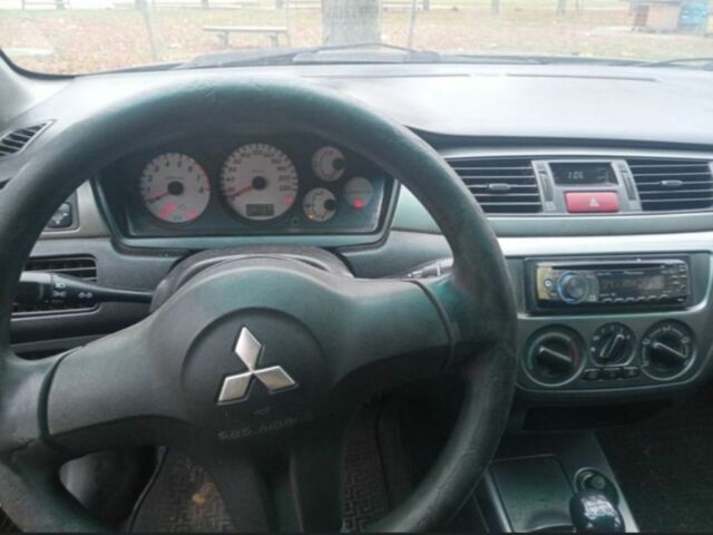 Черный Мицубиси Лансер, объемом двигателя 6 л и пробегом 190 тыс. км за 4500 $, фото 3 на Automoto.ua