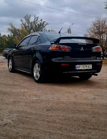 Черный Мицубиси Лансер, объемом двигателя 2 л и пробегом 211 тыс. км за 6900 $, фото 3 на Automoto.ua