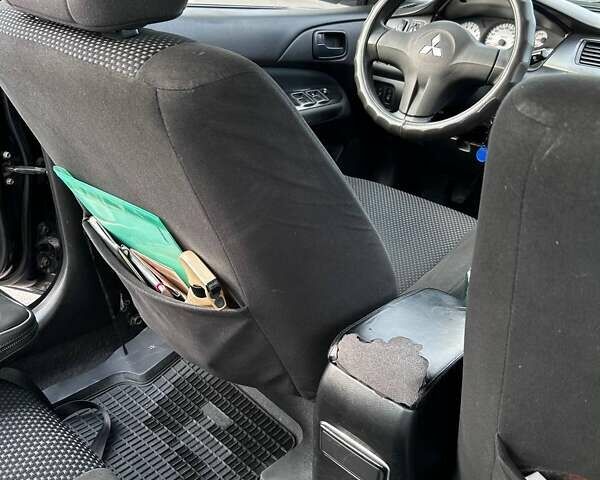 Чорний Міцубісі Lancer, об'ємом двигуна 1.6 л та пробігом 310 тис. км за 3500 $, фото 17 на Automoto.ua