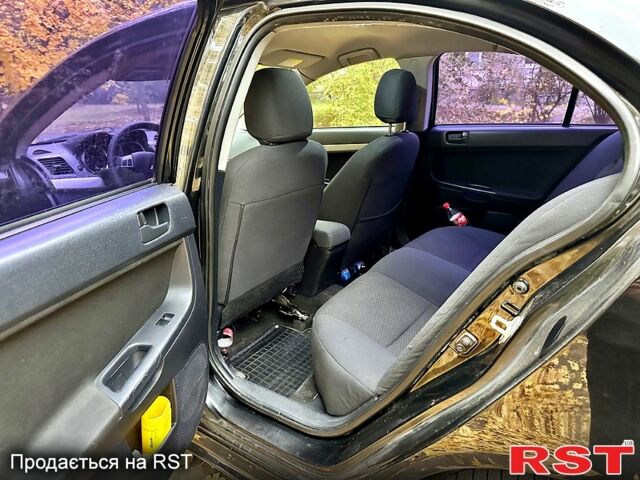 Чорний Міцубісі Lancer, об'ємом двигуна 2 л та пробігом 245 тис. км за 5500 $, фото 11 на Automoto.ua