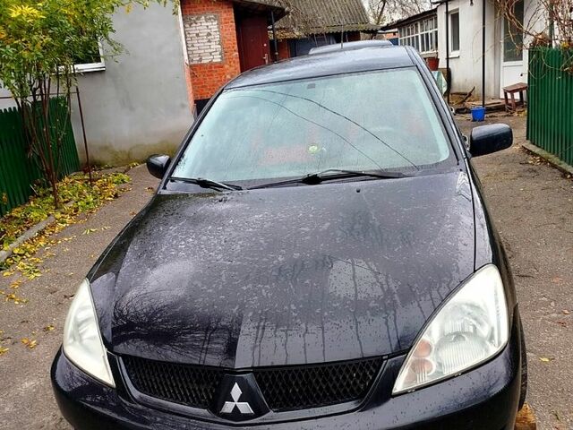 Чорний Міцубісі Lancer, об'ємом двигуна 1.6 л та пробігом 126 тис. км за 4500 $, фото 3 на Automoto.ua