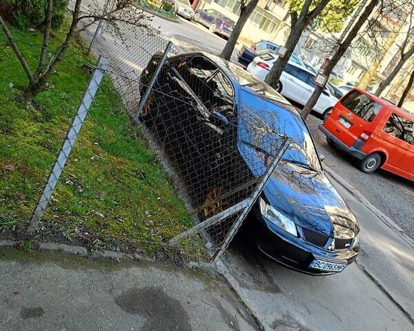 Мицубиси Лансер 2008 в Львове на Automoto.ua Черный Мицубиси Лансер, объемом двигателя 1.58 л и пробегом 200 тыс. км за 5200 $, фото 93 на Automoto.ua