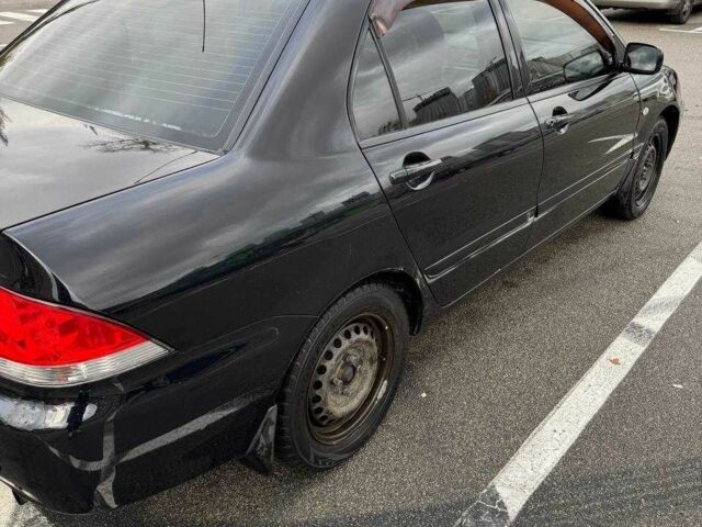 Чорний Міцубісі Lancer, об'ємом двигуна 1.6 л та пробігом 245 тис. км за 4500 $, фото 4 на Automoto.ua