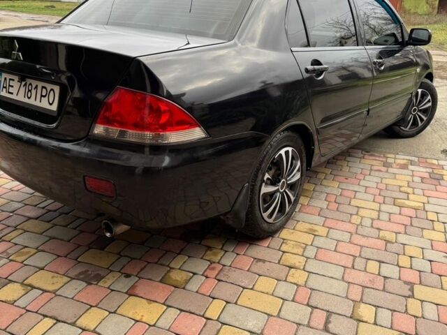 Чорний Міцубісі Lancer, об'ємом двигуна 1.6 л та пробігом 220 тис. км за 3600 $, фото 4 на Automoto.ua