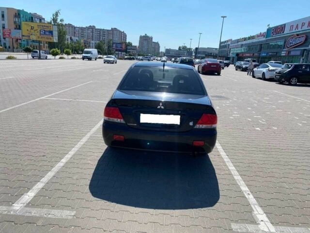 Чорний Міцубісі Lancer, об'ємом двигуна 1.6 л та пробігом 229 тис. км за 4200 $, фото 4 на Automoto.ua