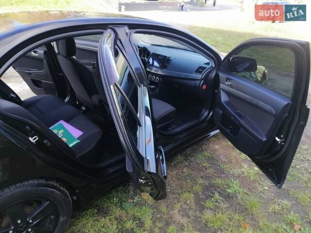 Мицубиси Лансер 2008 в Киеве на Automoto.ua Черный Мицубиси Лансер, объемом двигателя 2 л и пробегом 196 тыс. км за 5500 $, фото 24 на Automoto.ua
