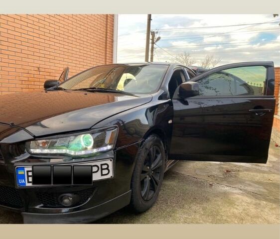 Черный Мицубиси Лансер, объемом двигателя 2 л и пробегом 140 тыс. км за 7200 $, фото 2 на Automoto.ua