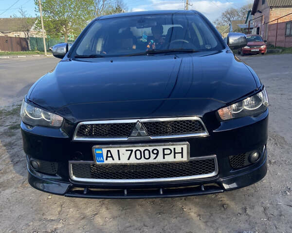 Чорний Міцубісі Lancer, об'ємом двигуна 2 л та пробігом 237 тис. км за 7599 $, фото 6 на Automoto.ua