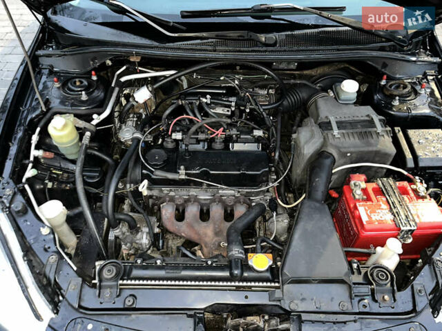 Чорний Міцубісі Lancer, об'ємом двигуна 1.6 л та пробігом 277 тис. км за 3900 $, фото 17 на Automoto.ua