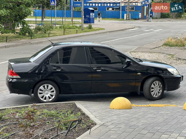 Черный Мицубиси Лансер, объемом двигателя 1.6 л и пробегом 167 тыс. км за 4850 $, фото 5 на Automoto.ua