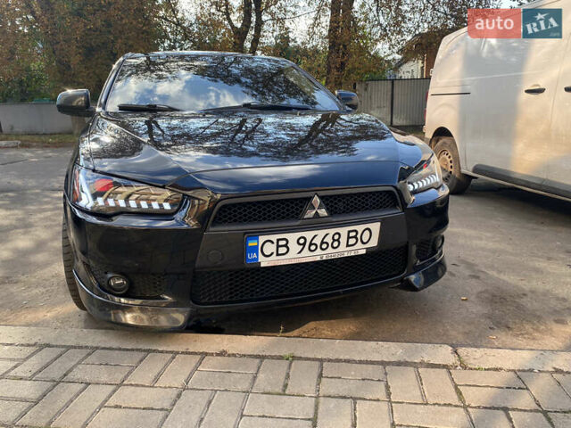 Черный Мицубиси Лансер, объемом двигателя 2 л и пробегом 86 тыс. км за 10000 $, фото 22 на Automoto.ua