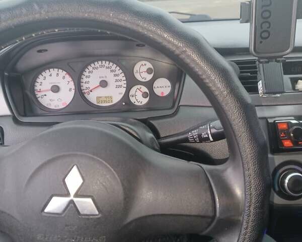 Чорний Міцубісі Lancer, об'ємом двигуна 1.58 л та пробігом 233 тис. км за 4800 $, фото 7 на Automoto.ua