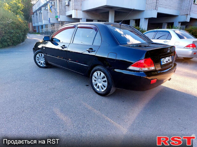 Черный Мицубиси Лансер, объемом двигателя 1.6 л и пробегом 216 тыс. км за 4500 $, фото 1 на Automoto.ua