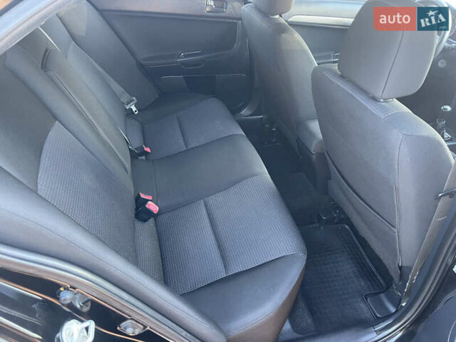 Черный Мицубиси Лансер, объемом двигателя 1.5 л и пробегом 263 тыс. км за 5300 $, фото 6 на Automoto.ua