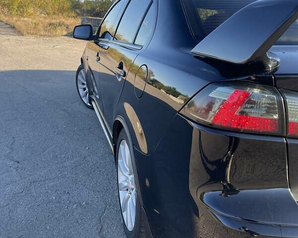 Чорний Міцубісі Lancer, об'ємом двигуна 2 л та пробігом 223 тис. км за 7800 $, фото 8 на Automoto.ua