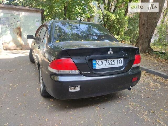 Чорний Міцубісі Lancer, об'ємом двигуна 1.6 л та пробігом 335 тис. км за 3100 $, фото 10 на Automoto.ua