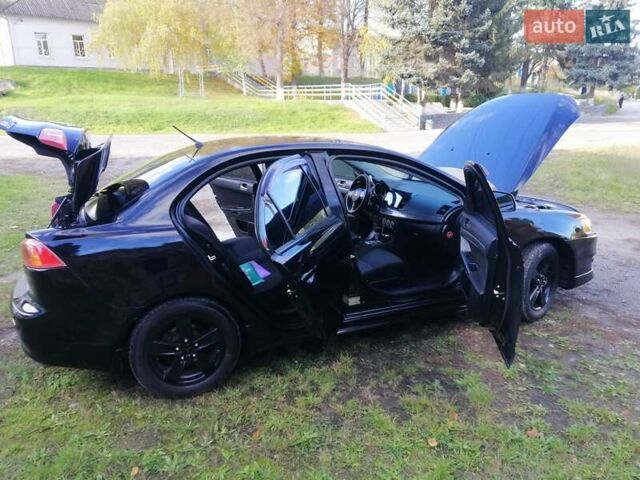 Мицубиси Лансер 2008 в Киеве на Automoto.ua Черный Мицубиси Лансер, объемом двигателя 2 л и пробегом 196 тыс. км за 5500 $, фото 34 на Automoto.ua