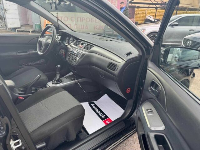 Мицубиси Лансер 2008 в Запорожье на Automoto.ua Черный Мицубиси Лансер, объемом двигателя 1.6 л и пробегом 316 тыс. км за 4290 $, фото 13 на Automoto.ua