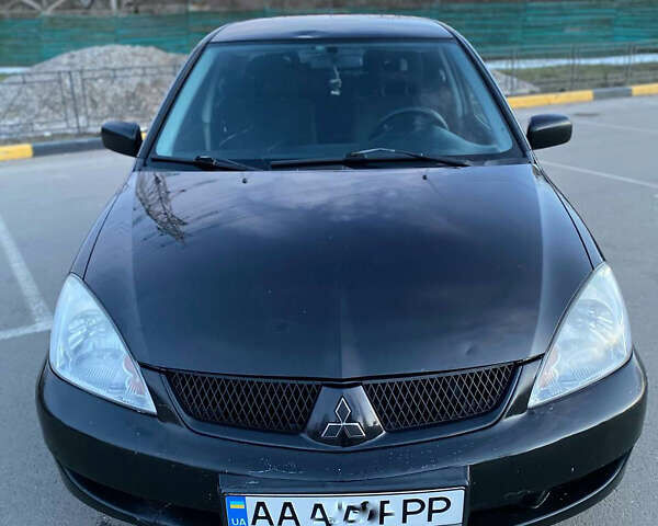 Чорний Міцубісі Lancer, об'ємом двигуна 1.58 л та пробігом 327 тис. км за 4000 $, фото 1 на Automoto.ua