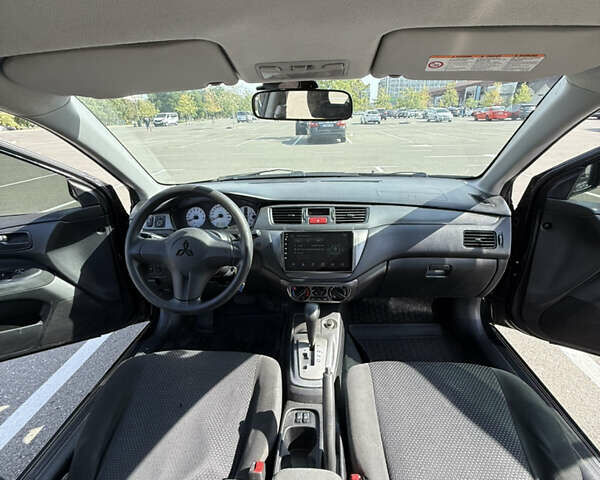 Черный Мицубиси Лансер, объемом двигателя 1.6 л и пробегом 321 тыс. км за 5000 $, фото 26 на Automoto.ua