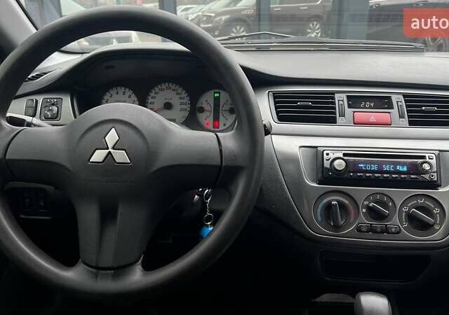 Чорний Міцубісі Lancer, об'ємом двигуна 1.6 л та пробігом 340 тис. км за 6190 $, фото 13 на Automoto.ua