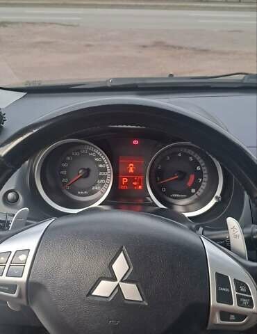 Черный Мицубиси Лансер, объемом двигателя 2 л и пробегом 211 тыс. км за 6900 $, фото 11 на Automoto.ua