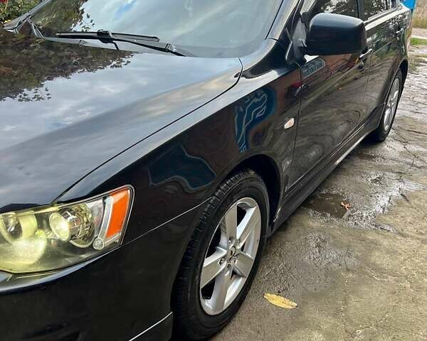 Черный Мицубиси Лансер, объемом двигателя 2 л и пробегом 214 тыс. км за 6300 $, фото 3 на Automoto.ua