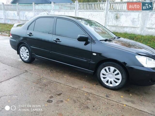 Мицубиси Лансер 2008 в Прилуках на Automoto.ua Черный Мицубиси Лансер, объемом двигателя 1.58 л и пробегом 219 тыс. км за 4900 $, фото 8 на Automoto.ua