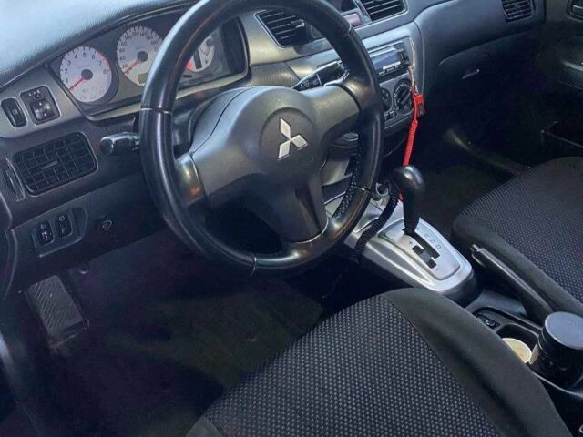 Чорний Міцубісі Lancer, об'ємом двигуна 1.6 л та пробігом 229 тис. км за 4200 $, фото 12 на Automoto.ua