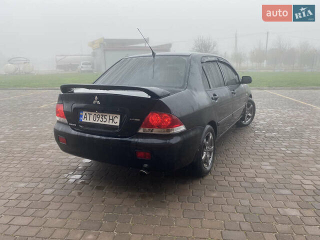 Черный Мицубиси Лансер, объемом двигателя 1.58 л и пробегом 211 тыс. км за 6333 $, фото 5 на Automoto.ua