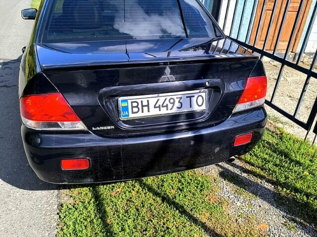 Чорний Міцубісі Lancer, об'ємом двигуна 1.6 л та пробігом 232 тис. км за 4400 $, фото 7 на Automoto.ua