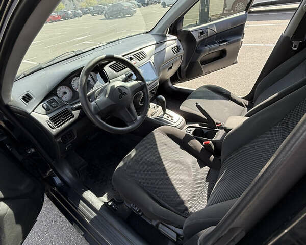 Черный Мицубиси Лансер, объемом двигателя 1.6 л и пробегом 321 тыс. км за 5000 $, фото 22 на Automoto.ua