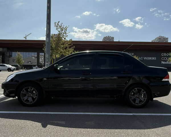 Черный Мицубиси Лансер, объемом двигателя 1.6 л и пробегом 321 тыс. км за 5000 $, фото 3 на Automoto.ua