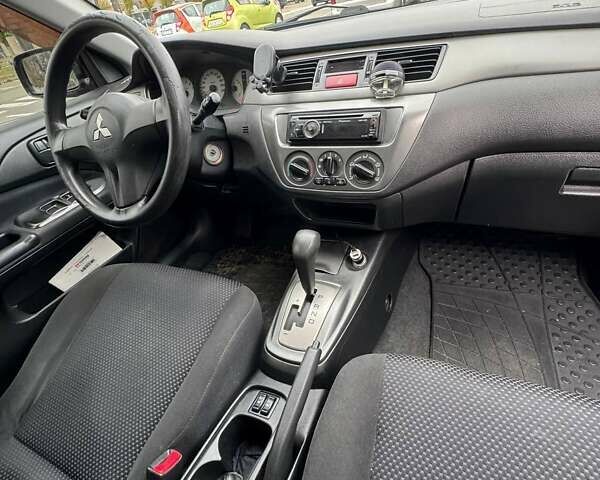 Чорний Міцубісі Lancer, об'ємом двигуна 1.6 л та пробігом 245 тис. км за 4500 $, фото 20 на Automoto.ua